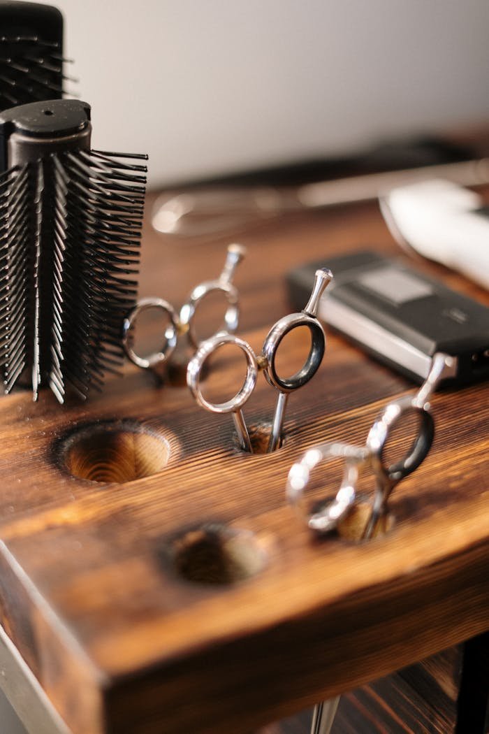 Silver and Black Skeleton Key on Brown Wooden Table